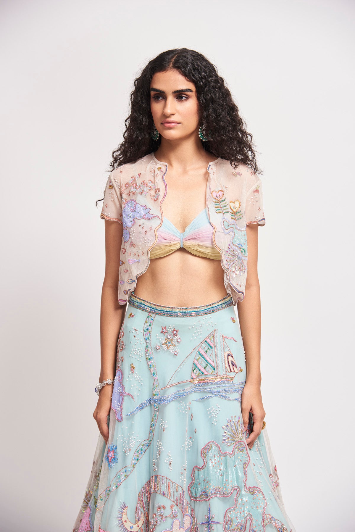 Close-up of front applique and blouse pleats.