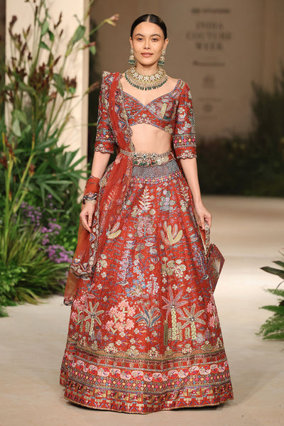 Wild At Heart rust applique embellished raw silk lehenga with blouse and tulle dupatta shown in a full couture view