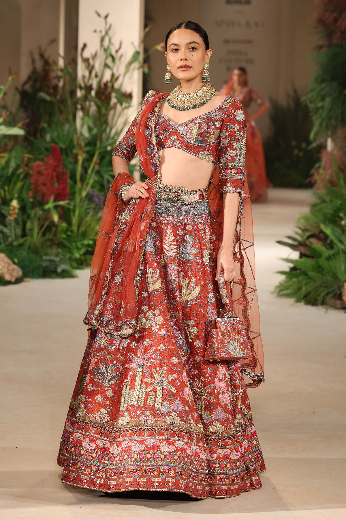 Styled look of the Wild At Heart rust applique embellished raw silk lehenga with blouse and tulle dupatta