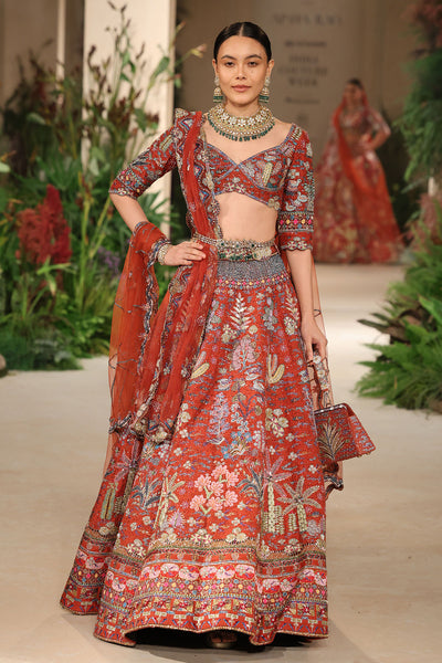 Waistline detail showing refined shaping and applique craftsmanship on the Wild At Heart rust lehenga