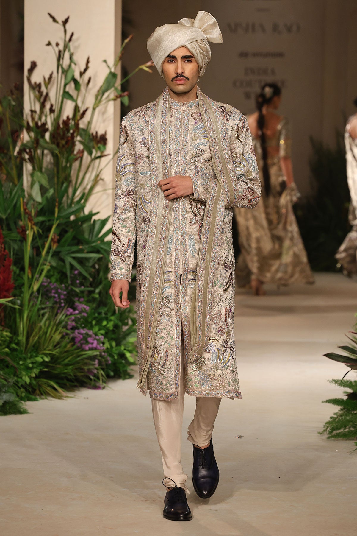 Brocade texture closeup from the Wild At Heart sandstone sherwani capturing its luminous tissue weave