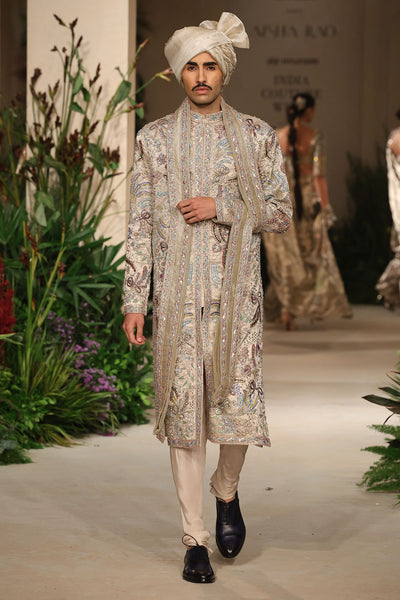 Brocade texture closeup from the Wild At Heart sandstone sherwani capturing its luminous tissue weave