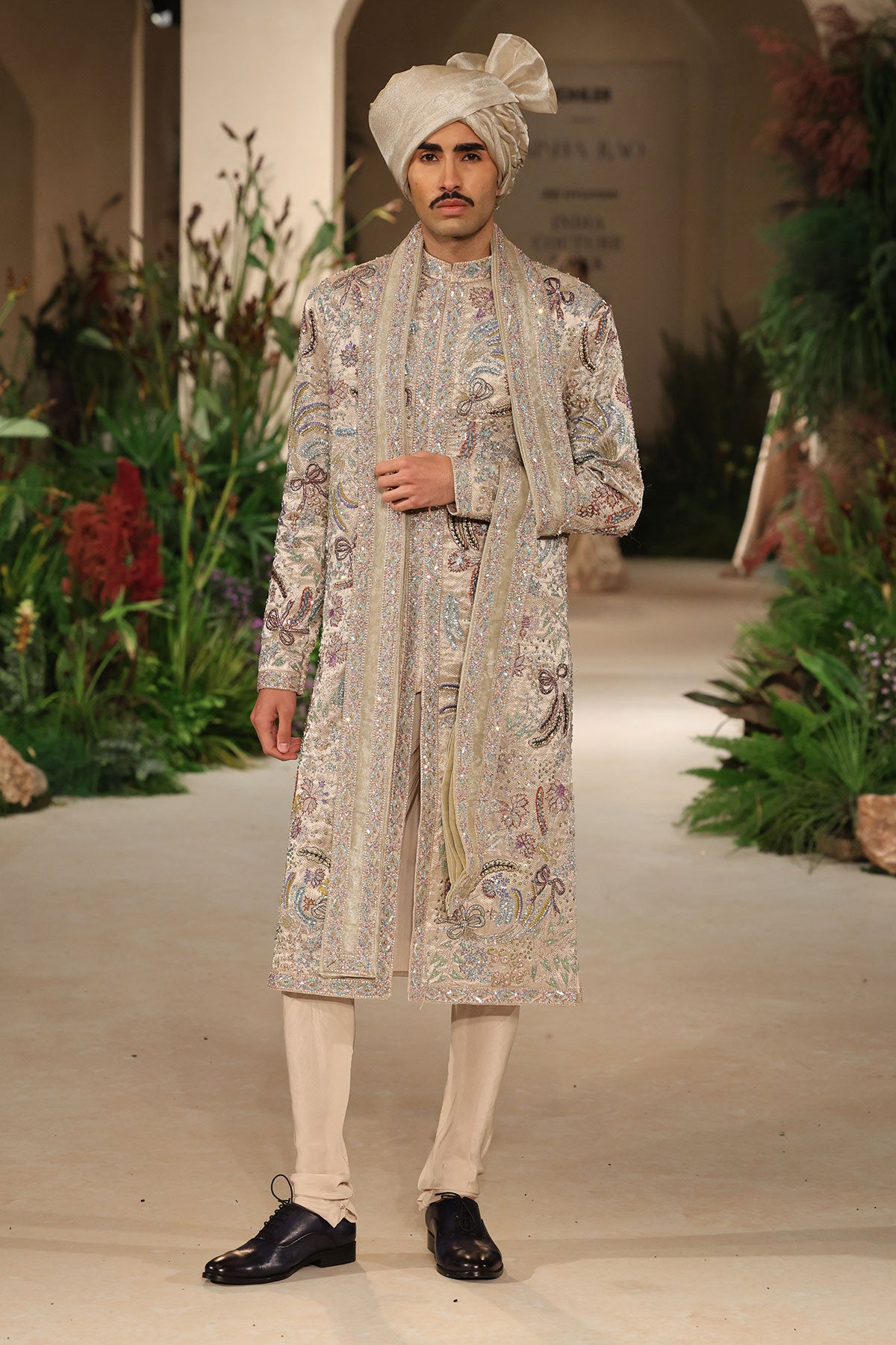 Front view of the Wild At Heart sandstone embellished sherwani highlighting applique craftsmanship and brocade texture
