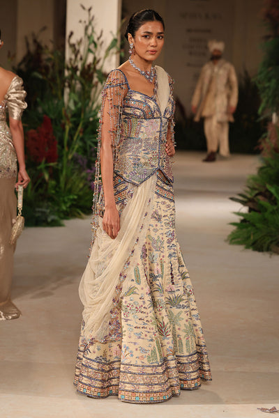 Blouse embellishment detail showing applique and refined finishing from the Wild At Heart ensemble