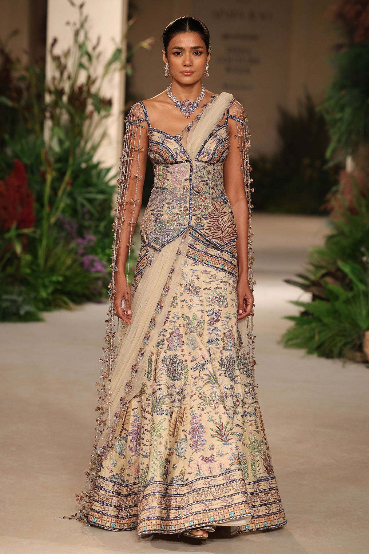 Wild At Heart sandstone applique embellished raw silk lehenga with sweetheart tassel detailed long blouse shown in a full couture view