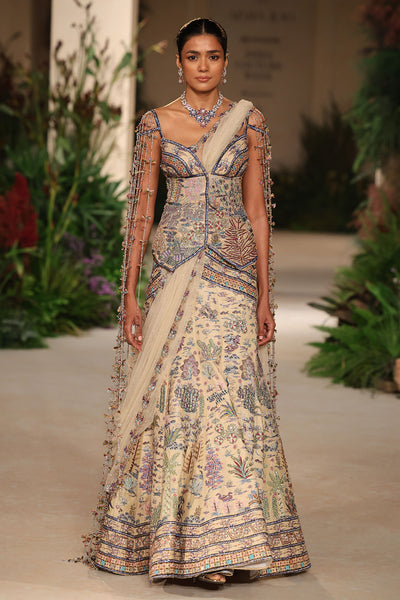 Wild At Heart sandstone applique embellished raw silk lehenga with sweetheart tassel detailed long blouse shown in a full couture view