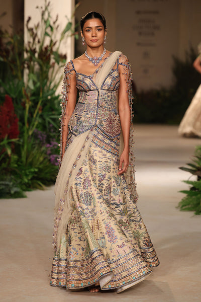 Wild At Heart sandstone raw silk lehenga captured in motion revealing fluid silk movement and layered applique
