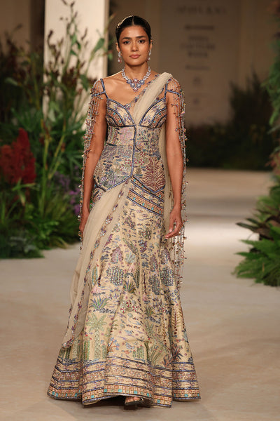 Tassel detailing from the sweetheart neckline long blouse enhancing the Wild At Heart sandstone lehenga look