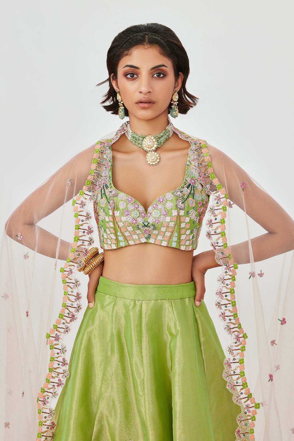 Scallop edge detail on dupatta in focus.