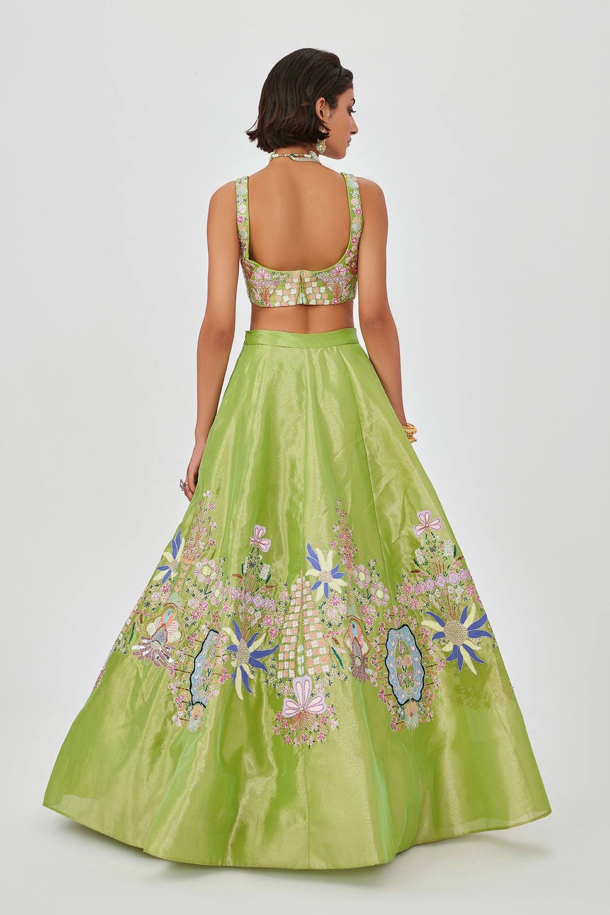 Embellishment and applique continuity on back panel