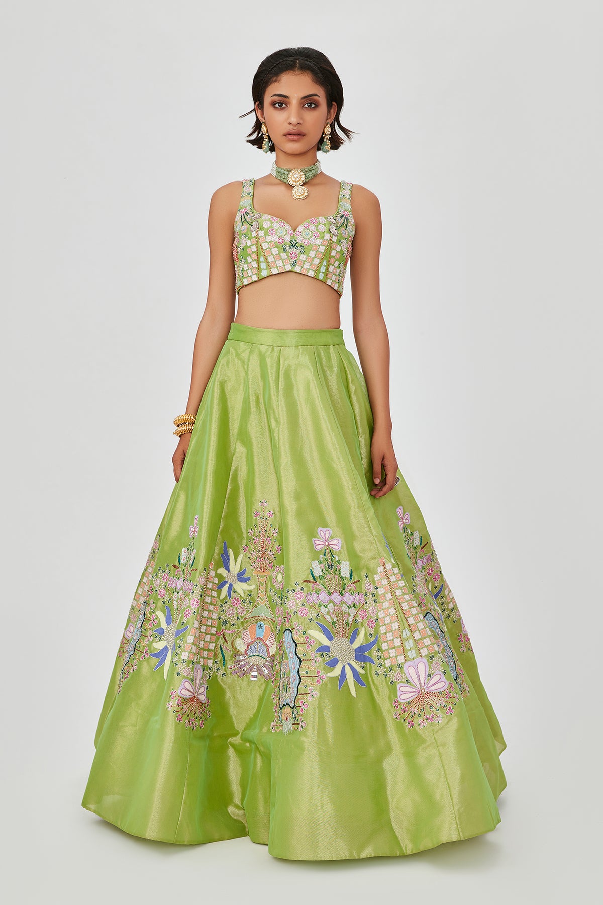 Heavy embellishments and applique work on lehenga.