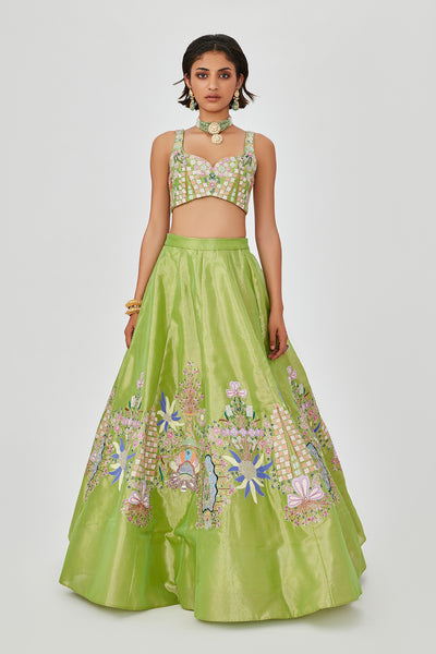 Heavy embellishments and applique work on lehenga.