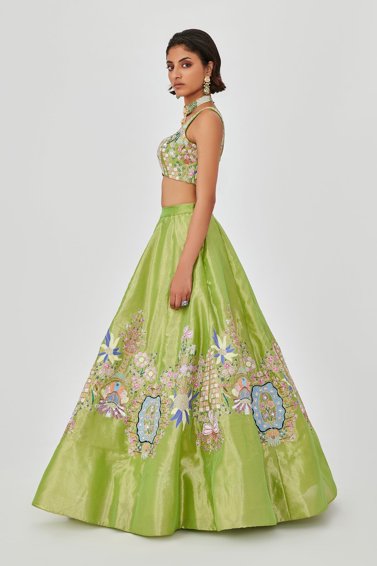 Left profile of Sheen Green embellished lehenga, blouse, and dupatta set