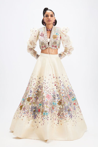 Woman wearing Aisha Rao ivory applique lehenga with jacket