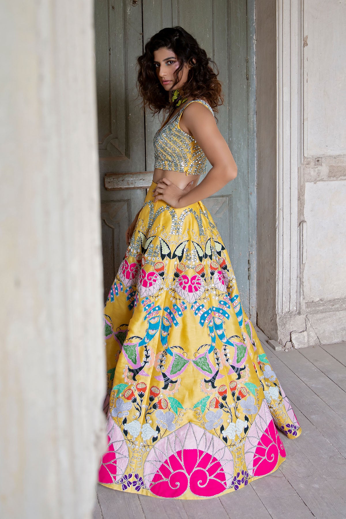 Left profile of applique blouse and flowing skirt