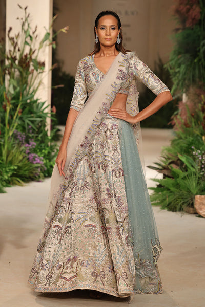 Back view of the Wild At Heart silver banarasi tissue brocade lehenga highlighting the bow hk detailing and embellished brocade