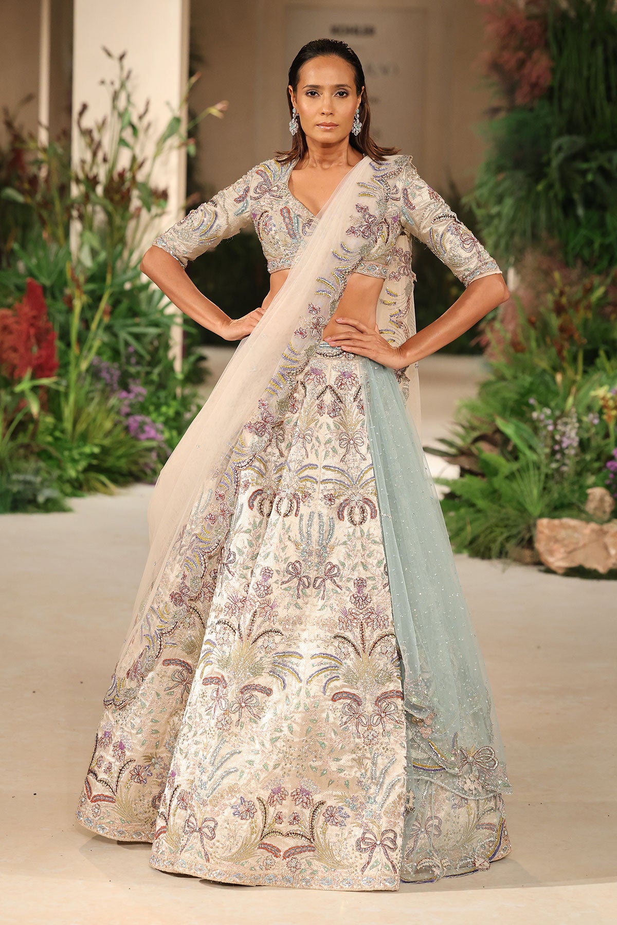 Front view of the blouse paired with the Wild At Heart silver banarasi tissue brocade bow hk lehenga