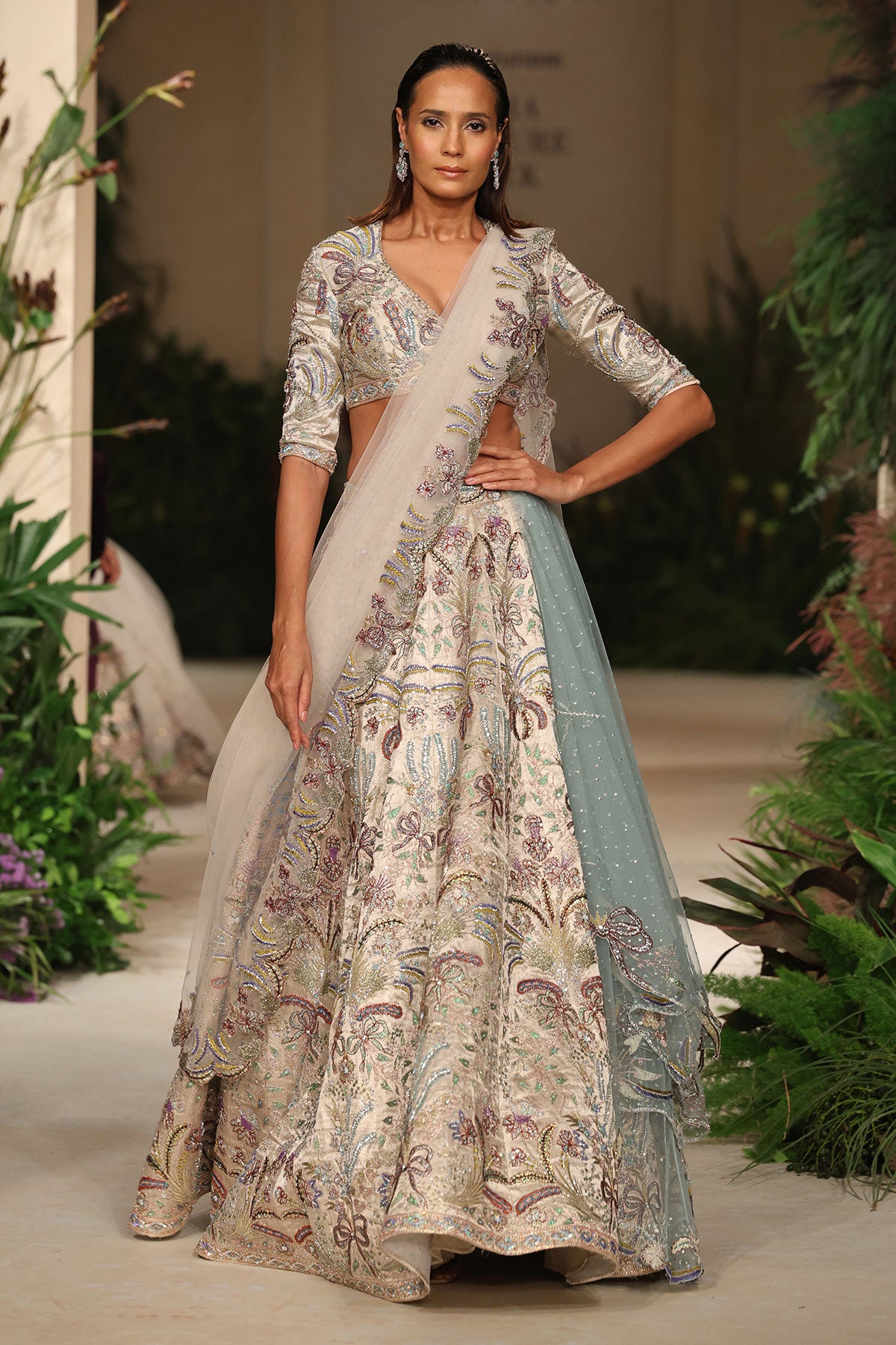 Wild At Heart silver applique embellished banarasi tissue brocade bow hk lehenga with blouse and ivory tulle dupatta shown in a full couture view