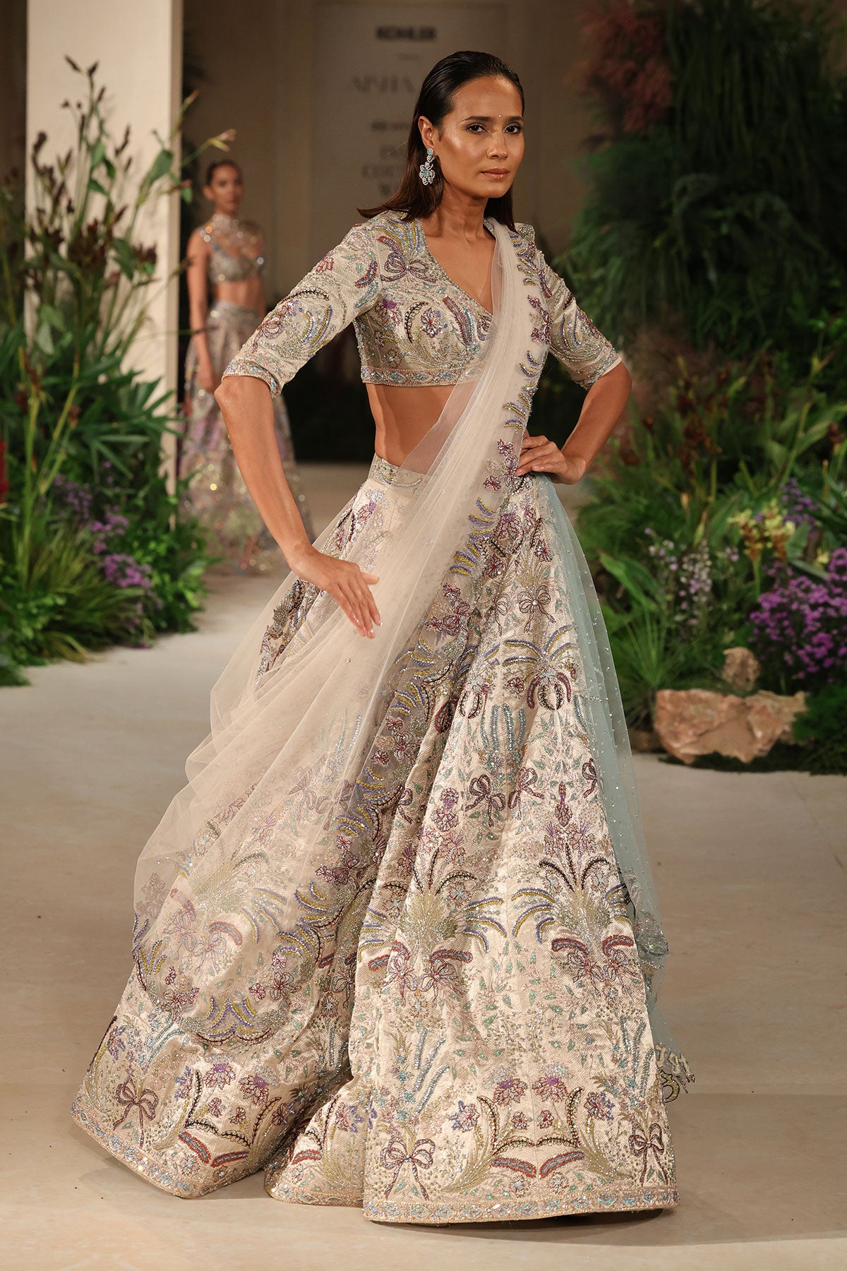 Styled look of the Wild At Heart silver applique embellished bow hk lehenga with blouse and ivory tulle dupatta