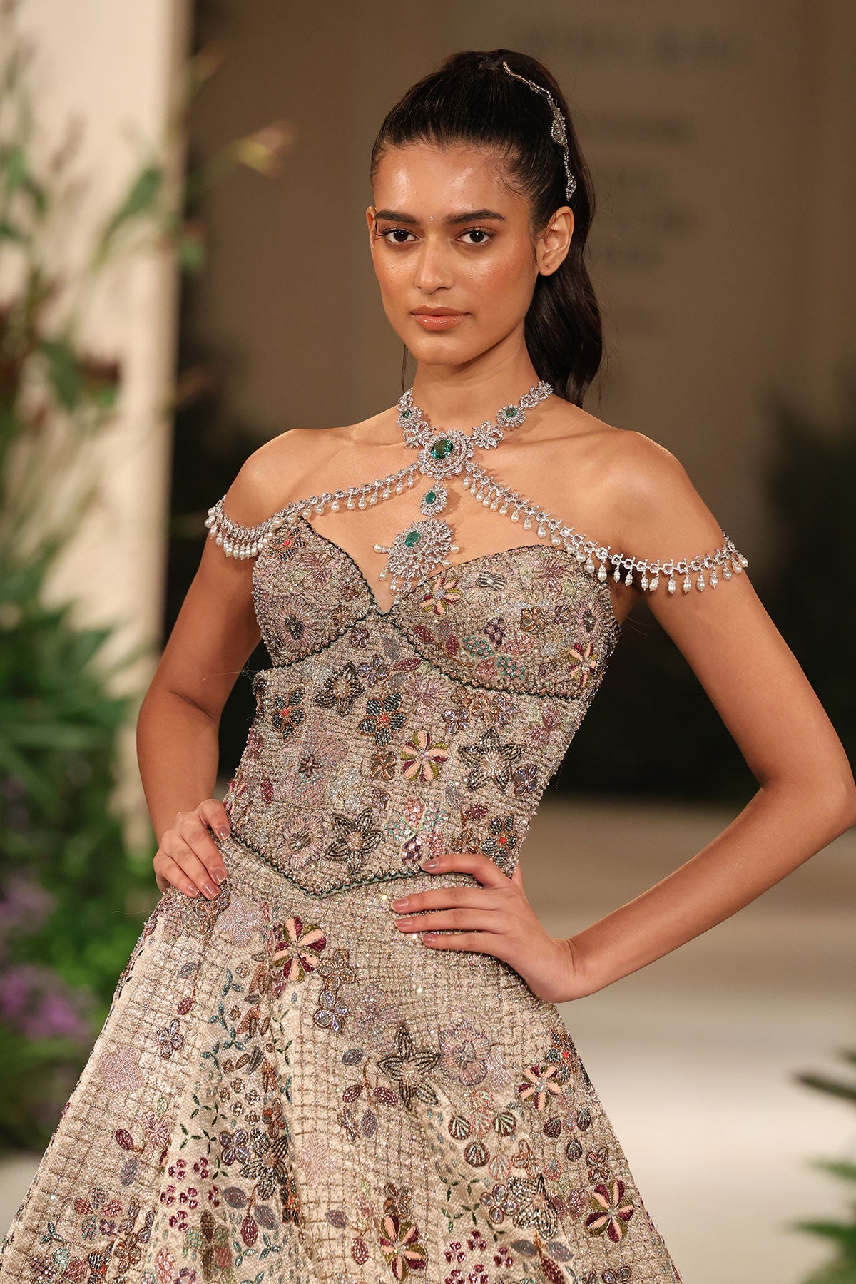 Wild At Heart silver check hk lehenga captured in motion revealing shimmering brocade and layered applique