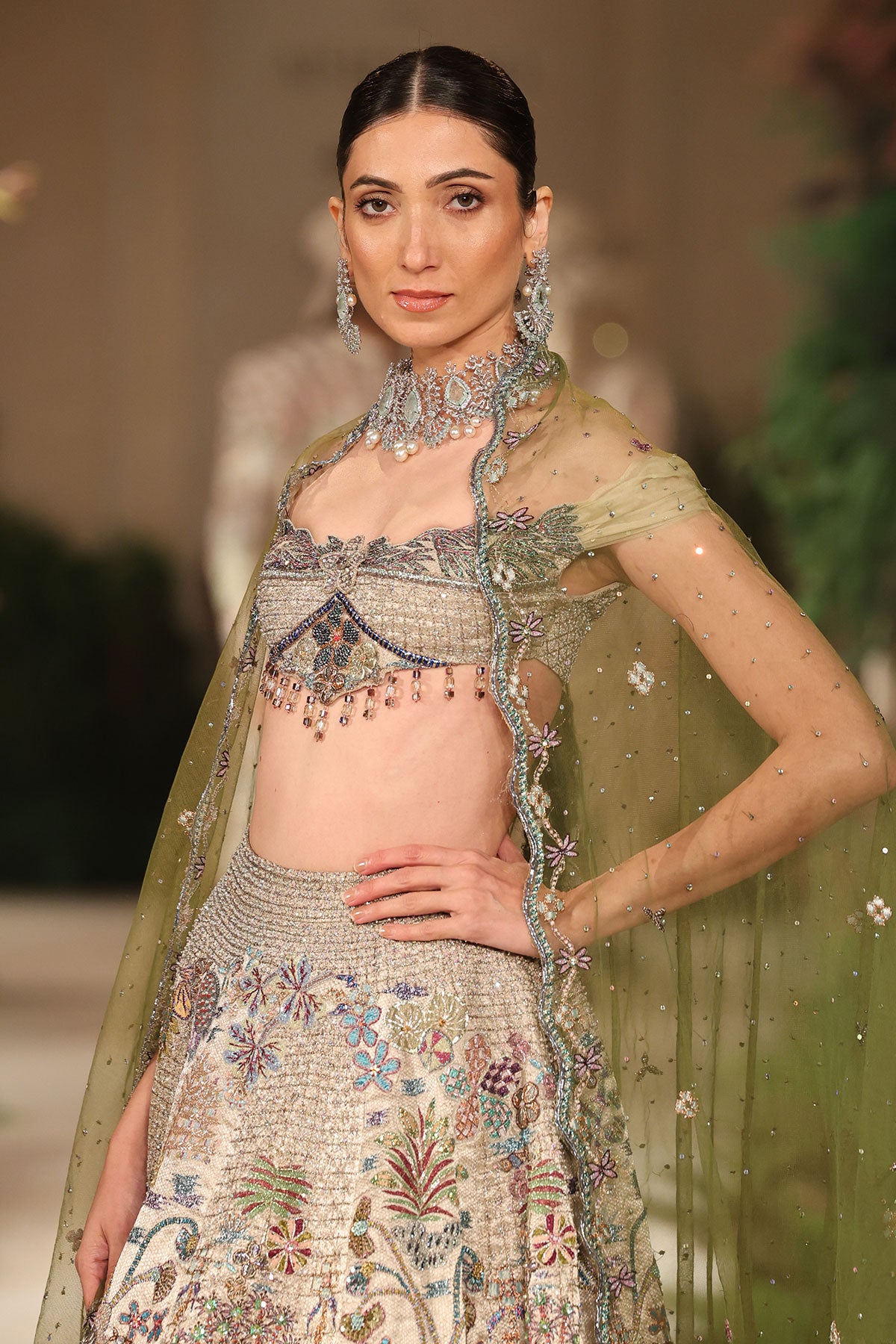 Front view of the blouse paired with the Wild At Heart silver applique embellished check lehenga