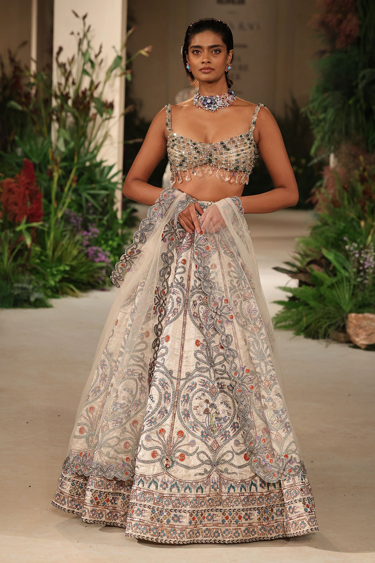 Wild At Heart silver applique embellished banarasi tissue brocade heart lehenga with crystal blouse and ivory tulle dupatta shown in a full couture view