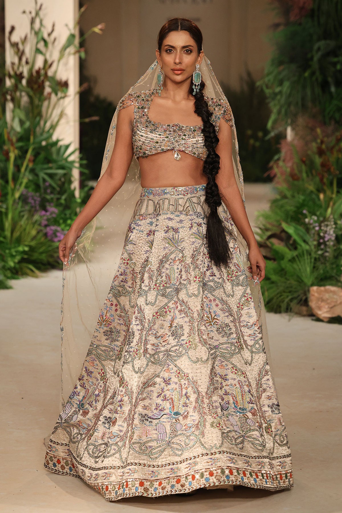 Front view of the Wild At Heart silver embellished brocade lehenga highlighting applique details and the crystal blouse
