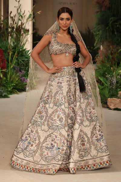 Wild At Heart silver applique embellished banarasi tissue brocade lehenga with crystal blouse and tulle veil shown in a full couture view