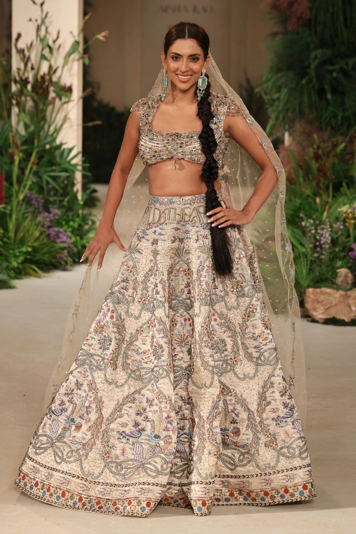 Wild At Heart silver brocade lehenga captured in motion revealing shimmering brocade and airy tulle veil movement