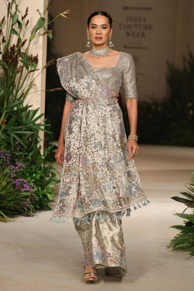 Closeup of the applique work on the silver tissue brocade saree showing refined craftsmanship