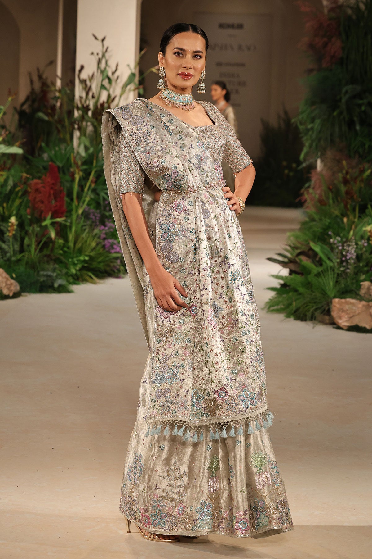 Pallu detail showcasing embellished patterns and delicate applique motifs