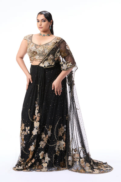 Front view of model wearing black tulle pre-draped saree featuring intricate applique work