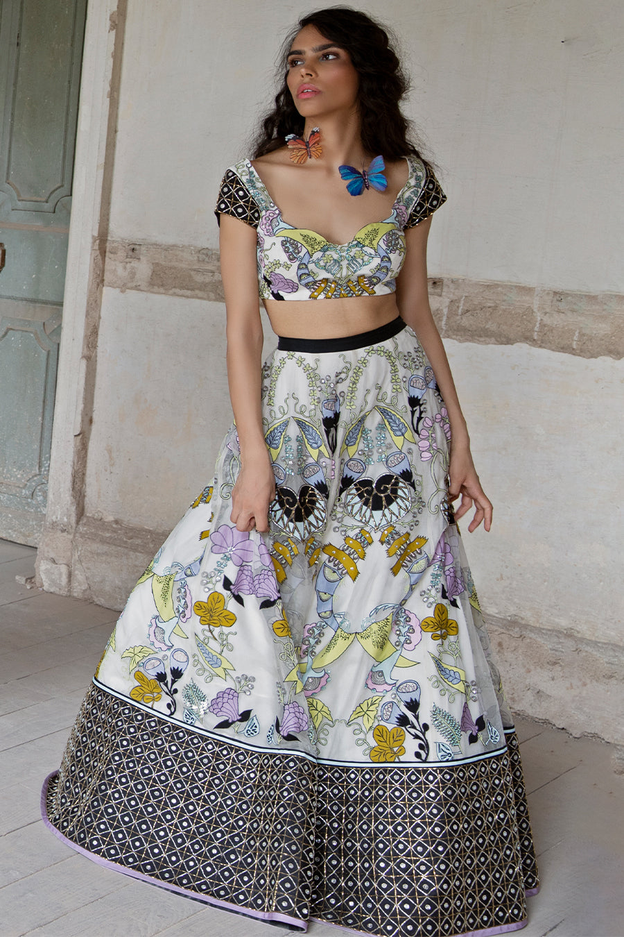 Applique tulle dupatta draped over black-white blouse