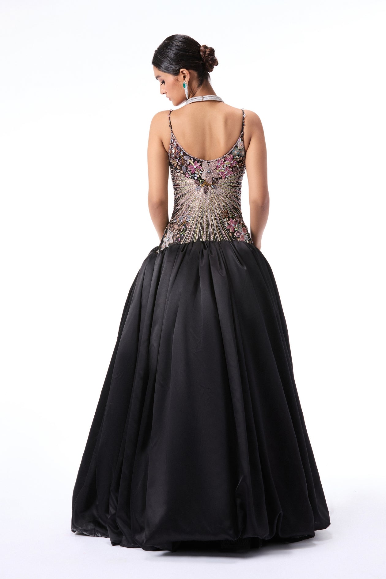 Back view of black applique embellished gown featuring tulle bodice and taffeta satin skirt by Aisha Rao