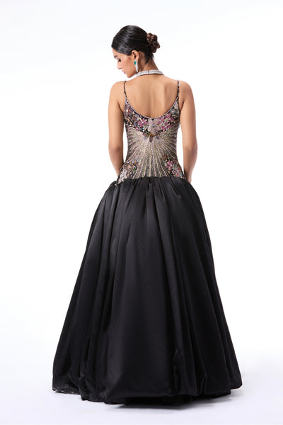 Back view of black applique embellished gown featuring tulle bodice and taffeta satin skirt by Aisha Rao