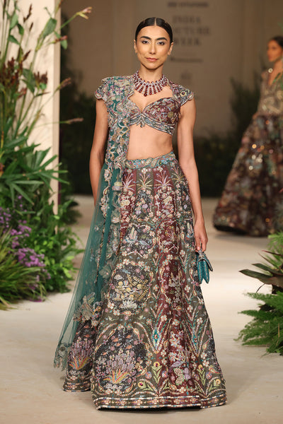 Front view of the blouse paired with the Wild At Heart teakberry gunmetal raw silk frame lehenga