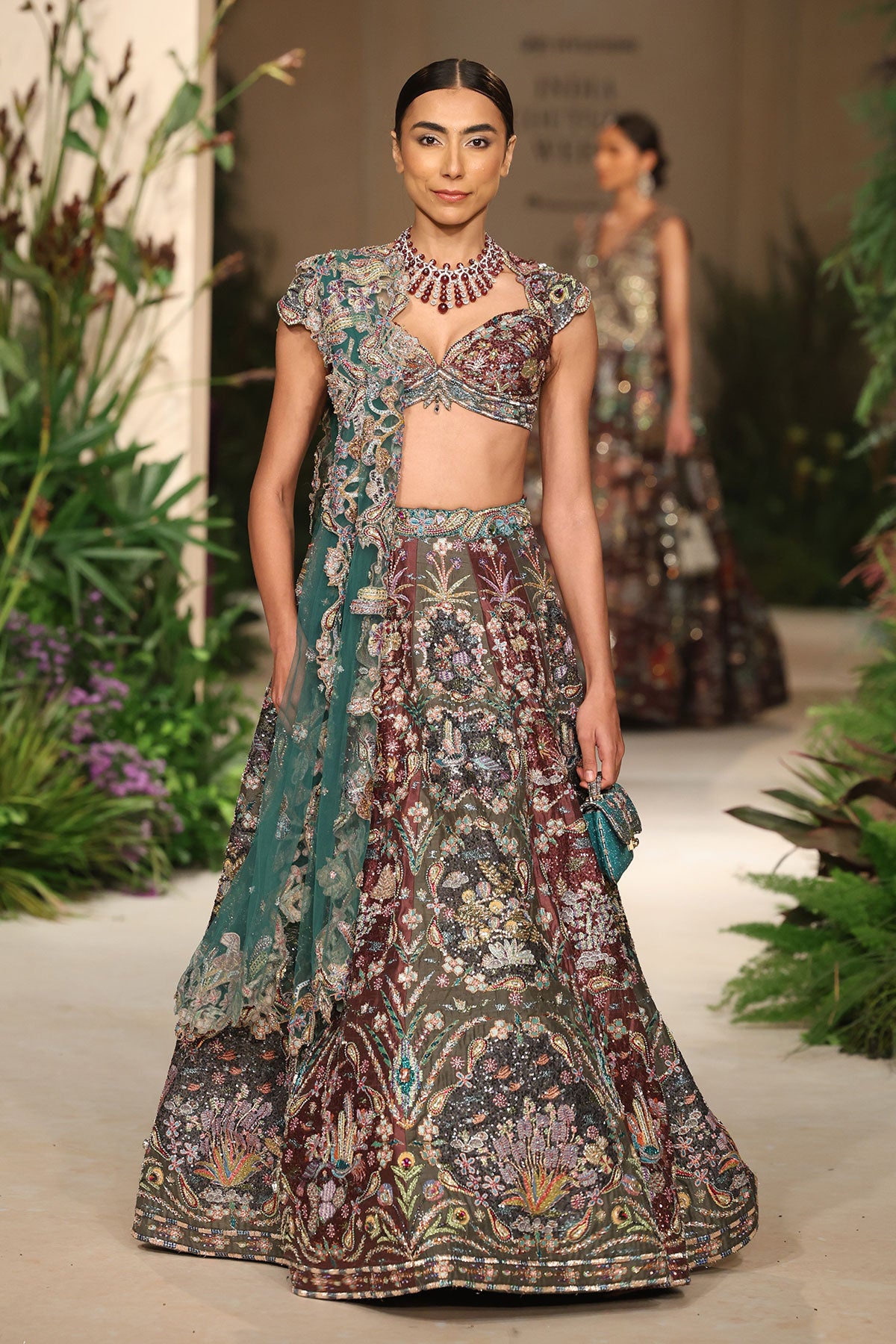 Wild At Heart teakberry gunmetal applique embellished raw silk frame lehenga with blouse and tulle dupatta shown in a full couture view