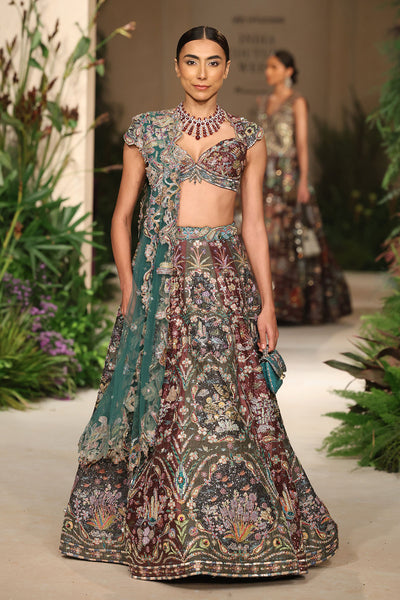 Wild At Heart teakberry gunmetal applique embellished raw silk frame lehenga with blouse and tulle dupatta shown in a full couture view