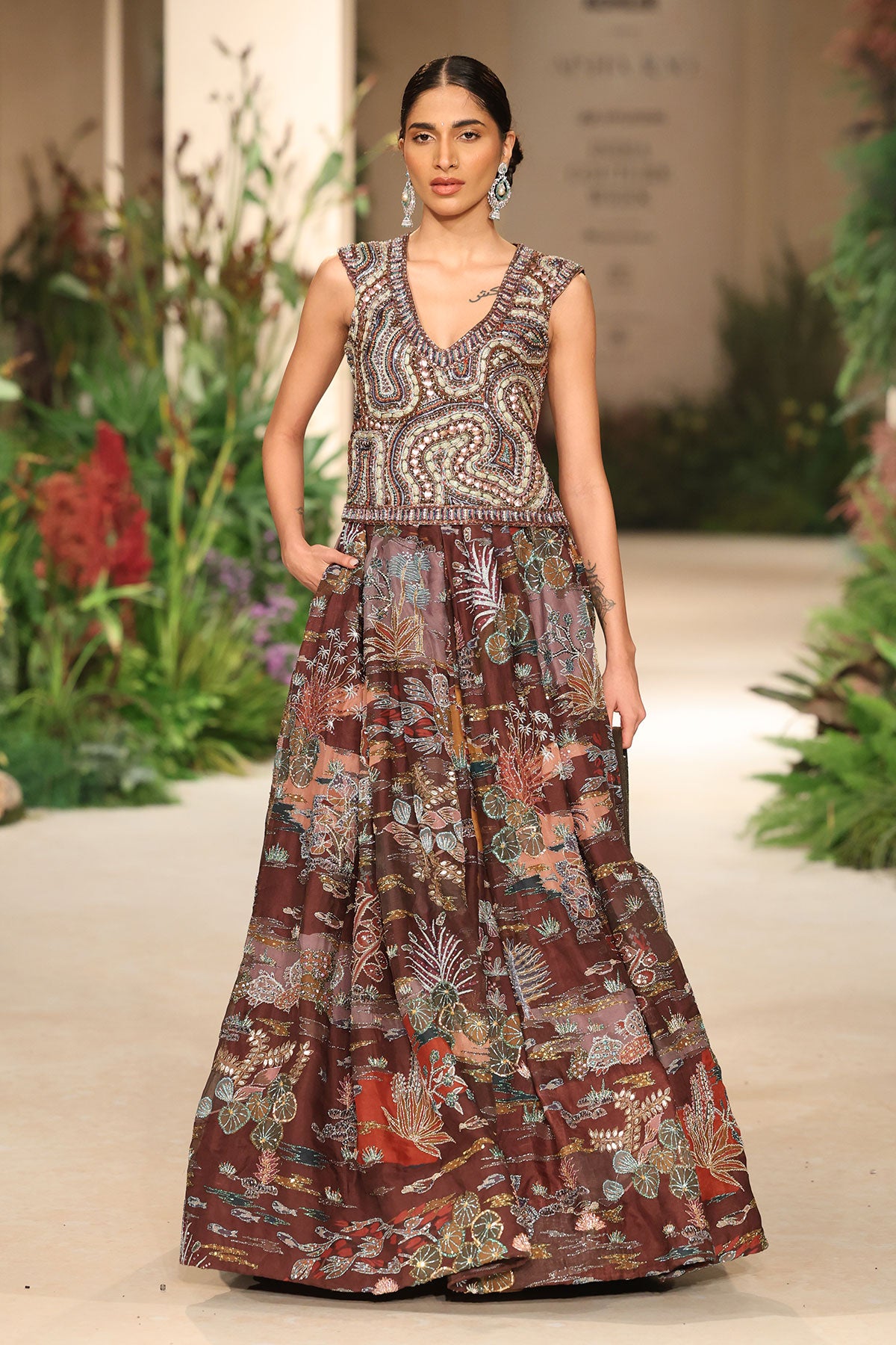 Wild At Heart teakberry organza lehenga captured in motion showing airy organza layers and printed movement