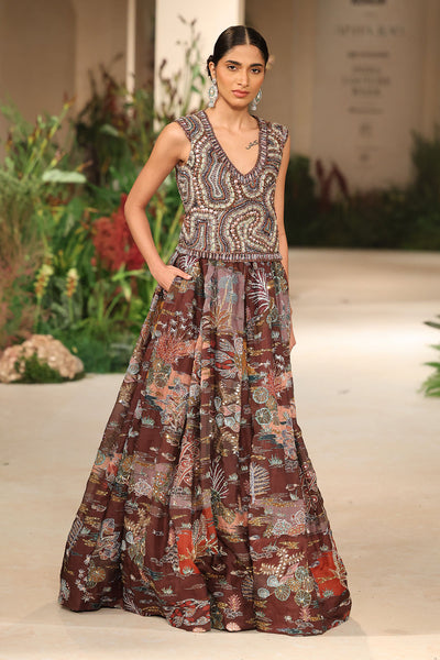 Side profile presenting the Wild At Heart teakberry organza lehenga with printed patterns and applique refinement