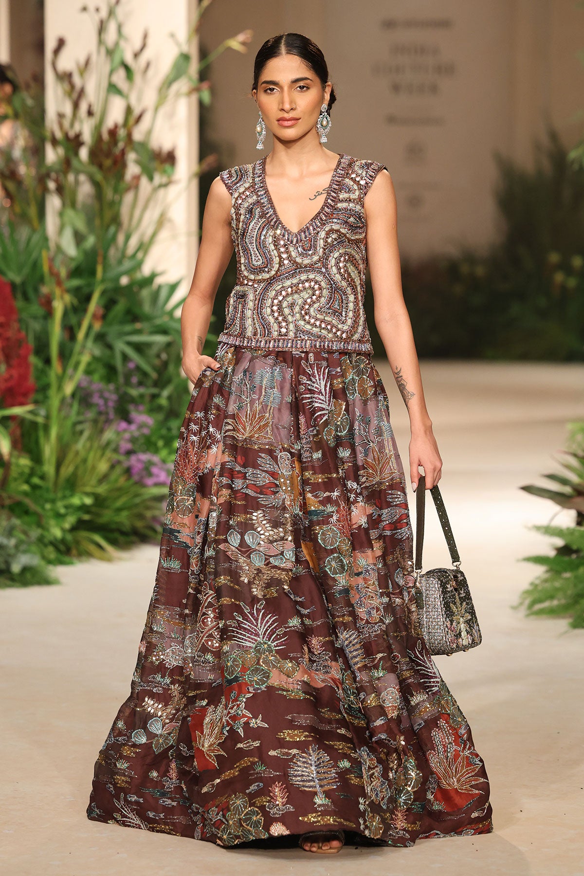 Front view of the sweater blouse paired with the Wild At Heart teakberry organza lehenga