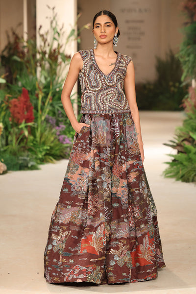 Waistline detail featuring couture shaping and applique refinement from the Wild At Heart teakberry lehenga