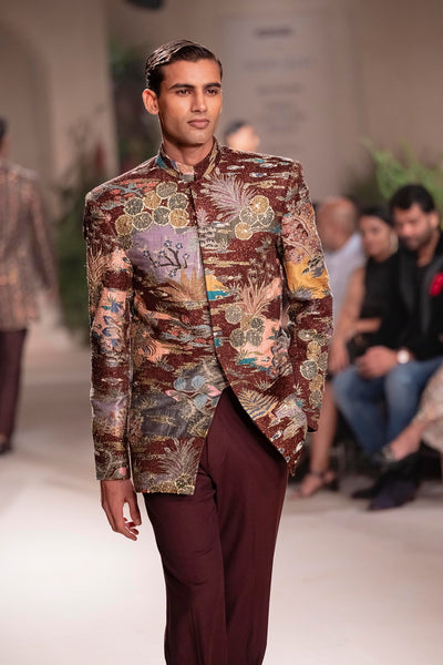 Front view of the Wild At Heart teakberry raw silk bandhgala highlighting printed motifs and applique detailing