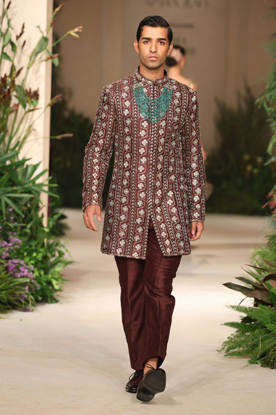 Printed detail from the Wild At Heart teakberry raw silk bandhgala showing artistic motif work