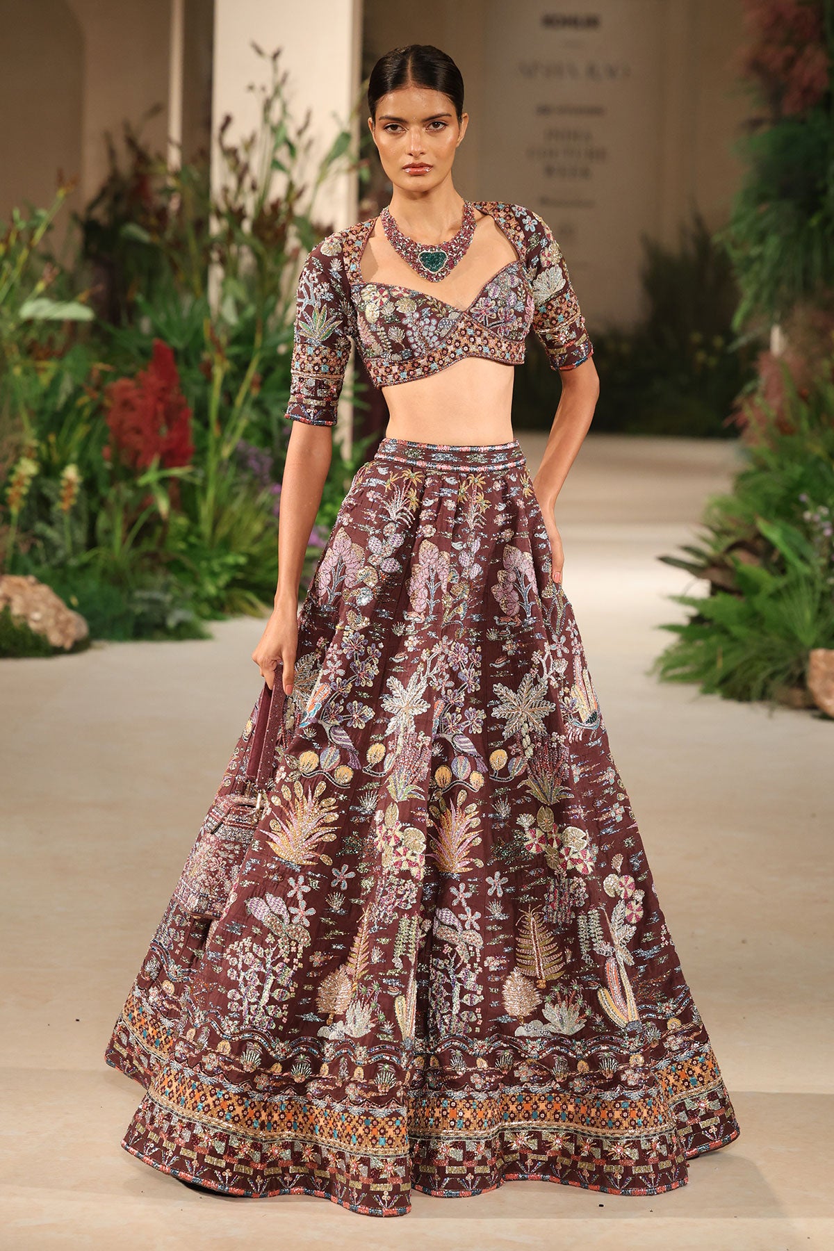 Wild At Heart teakberry raw silk lehenga captured in motion showing silk movement and applique shimmer