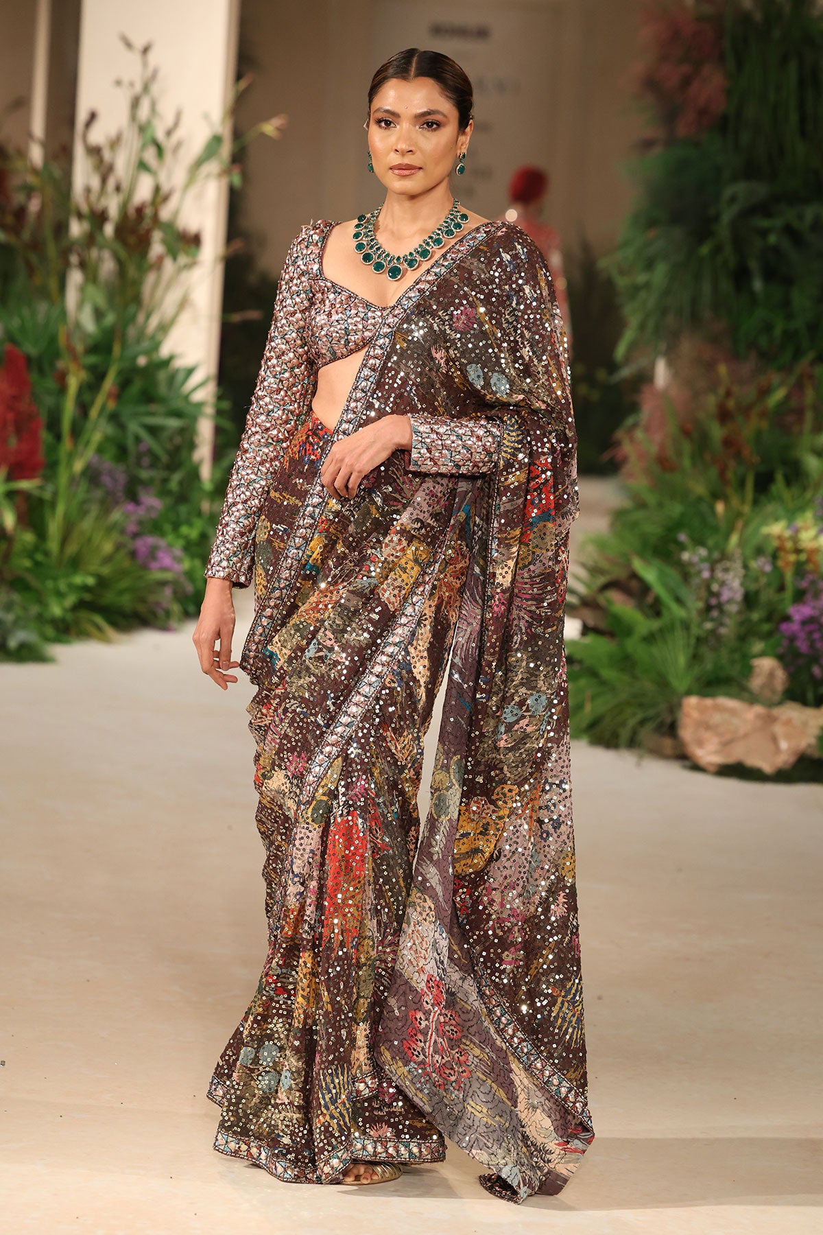 Front view of the tulle embellished beaded full sleeve blouse paired with the Wild At Heart teakberry georgette saree