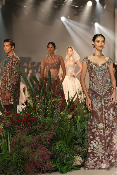 Movement frame showing ethereal tulle flow from the Wild At Heart teakberry applique embellished gown