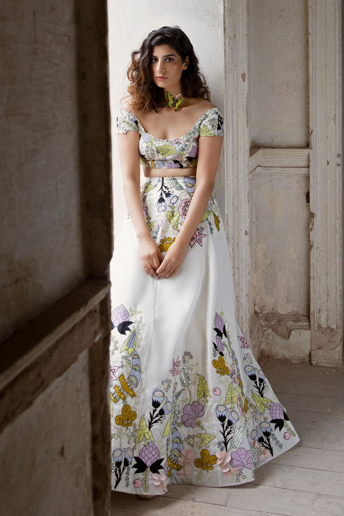 Woman in white applique raw silk lehenga