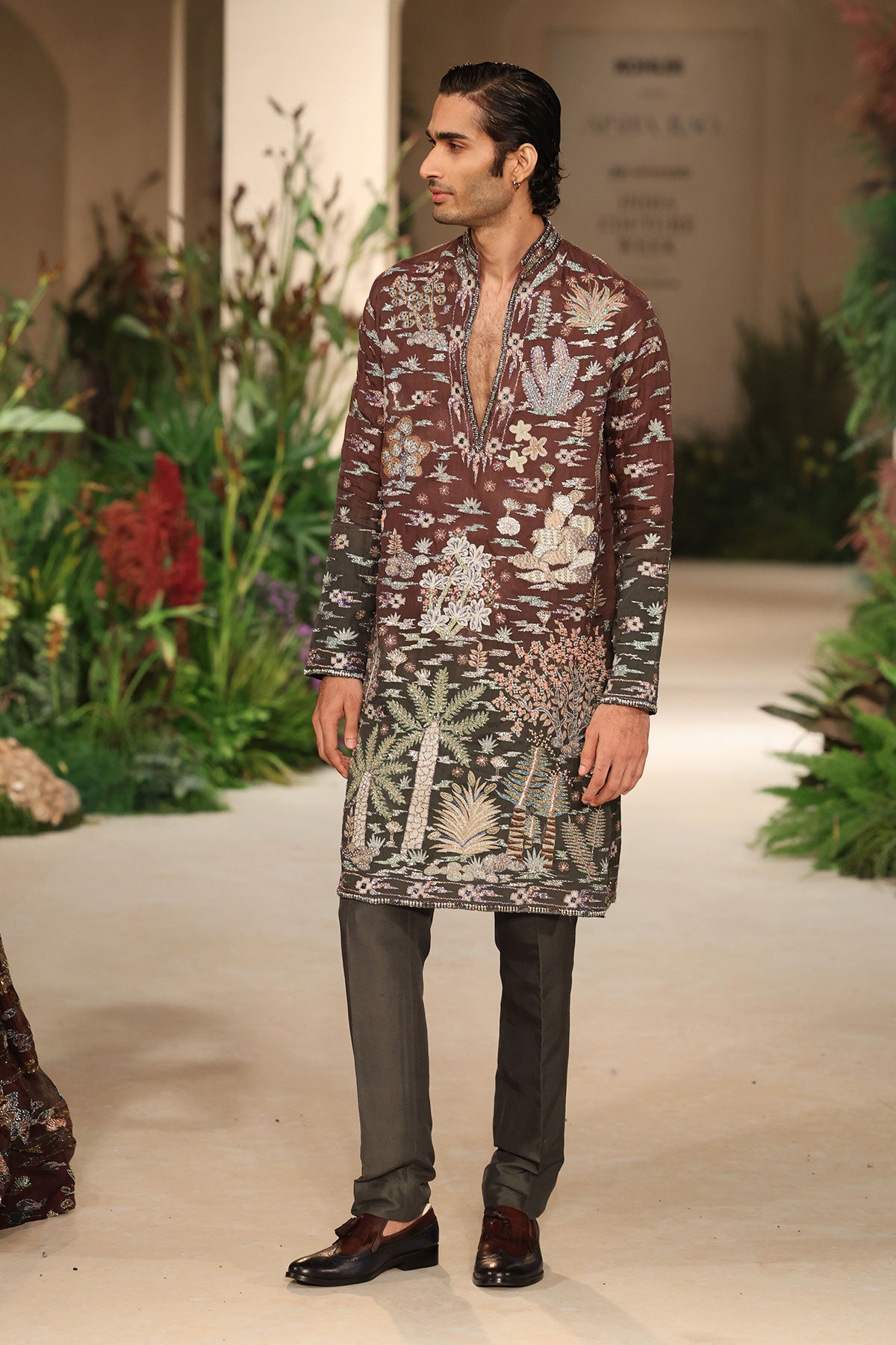 Side angle view of Allu Arjun in the teakberry-gunmetal ombre applique embellished organza kurta.