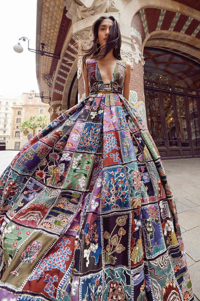 Woman wearing Aisha Rao black frames printed organza gown